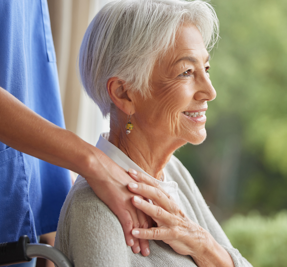 Elderly woman receiving support at home from a carer